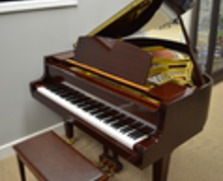 Polished mahogany Yamaha baby grand